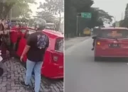 Bikin Heboh! Polisi Selidiki Pria Bergelantungan di Mobil Merah, Aksi Nekat yang Viral di Jakarta Barat
