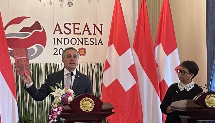 Swiss Menghadapi Demontrasi dan Pemilu, Sementara Tim Hoki Es Membuat Pengumuman